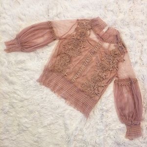 Flower detailed blouses and a blouse with a belt